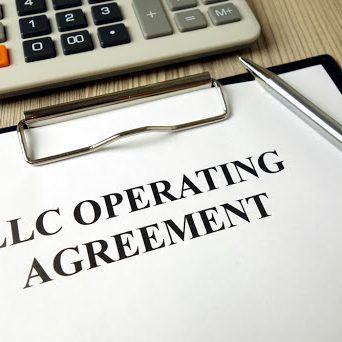 Do you have an Operating Agreement for your LLCLLC operating agreement, pen and calculator on desk, business concept Do you have an Operating Agreement for your LLC