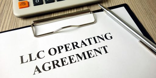 Do you have an Operating Agreement for your LLCLLC operating agreement, pen and calculator on desk, business concept Do you have an Operating Agreement for your LLC